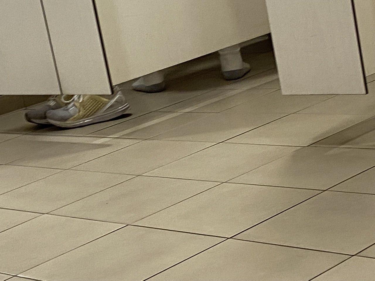 Image of guy that took of his shoes to take a piss, socks on toilet floor and everything